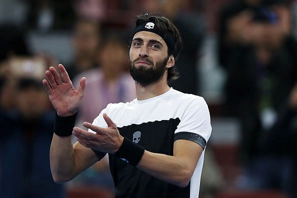 Nikoloz Basilashvili acknowledges the crowd after winning the China Open