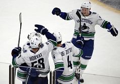 Canucks beat Bruins 8-5 for 5th straight win