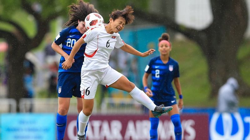 Sophia Jones of the USA no 20 and no 6 Ri Su-Jong of North Korea in action (Image Courtesy: FIFA)