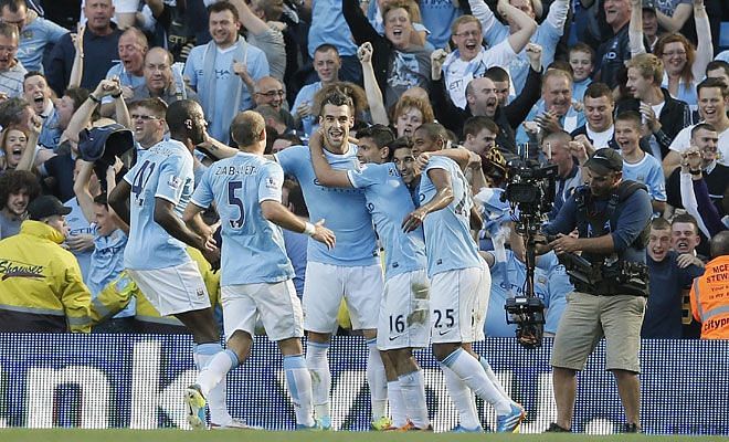Manchester City celebrates a goal against Manchester United