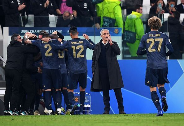 Manchester United players celebrate after scoring in their group stage match against Juventus