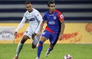 Bengaluru FC's Dimas Delgado wins a tussle with Robin Singh of FC Pune City