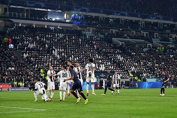 Mata watches on as his sweetly-struck effort flies over the Juventus wall goalwards