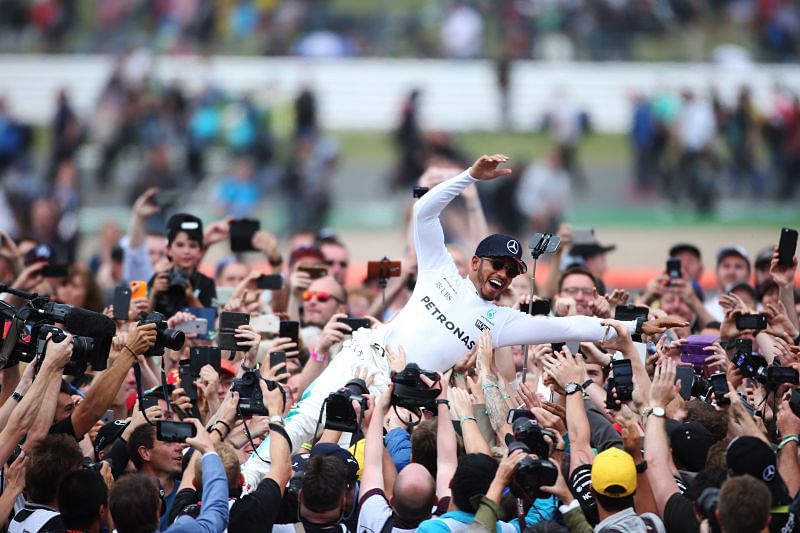 Hamilton crowd surfing after winning his home Grand Prix at Silverstone in 2017