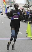 Runner who lost feet to frostbite completes first marathon