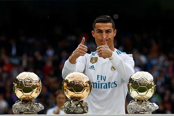 Ronaldo poses with his Ballon d&#039;Or trophies