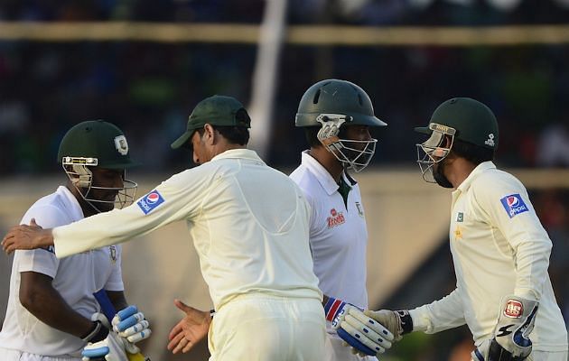 Tamim Iqbal and Imrul Kayes are being congratulated by Pakistan players after the record-stand