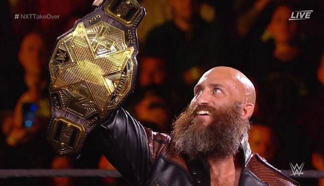 Tommaso Ciampa proudly holds up the NXT Championship in his title defense at NXT TakeOver: War Games II