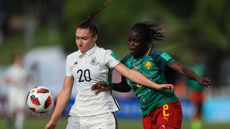 Number 20 Sophie Weidauer from Germany and Florence Fanta of Cameroon in action (Image Courtesy: FIFA)