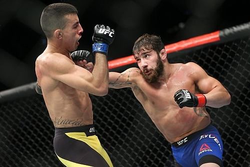 Jimmie Rivera (R) lands a straight right hand against Thomas Almeida (L)