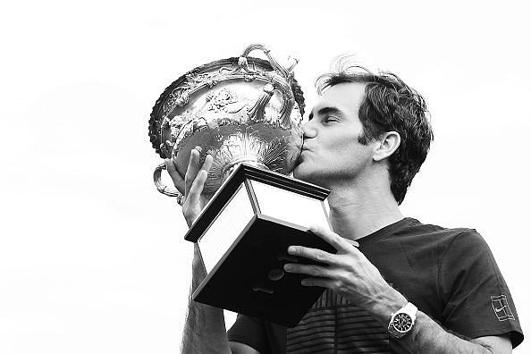 Roger Federer lifts the Norman Brookes Challenge Cup 2018