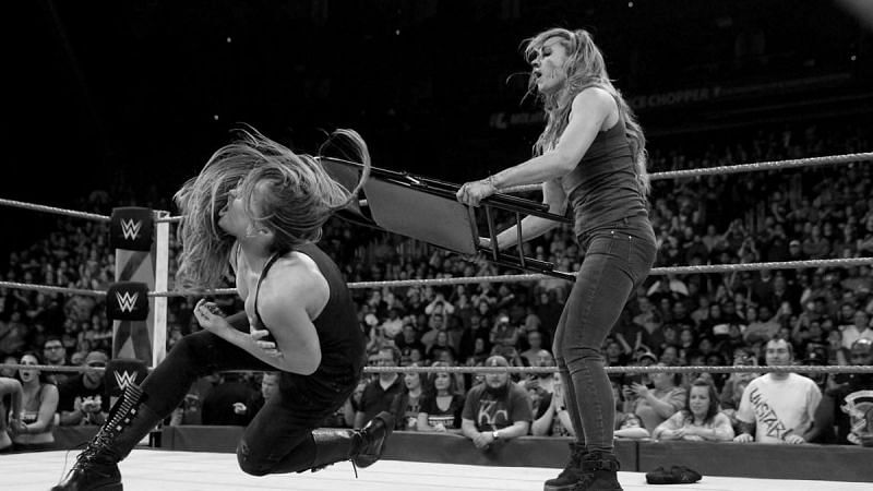 Becky Lynch hits Ronda Rousey with a steel chair