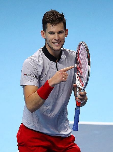Thiem points towards his racquet after a change in strings helped him secure a great win