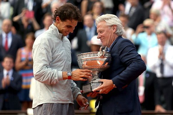 Bjorn Borg presents the 2014 French Open trophy to Rafael Nadal