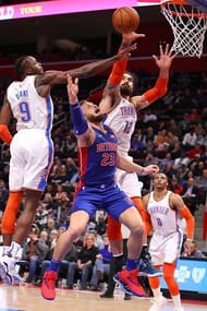 Grant and Adams defending the basket against Pistons