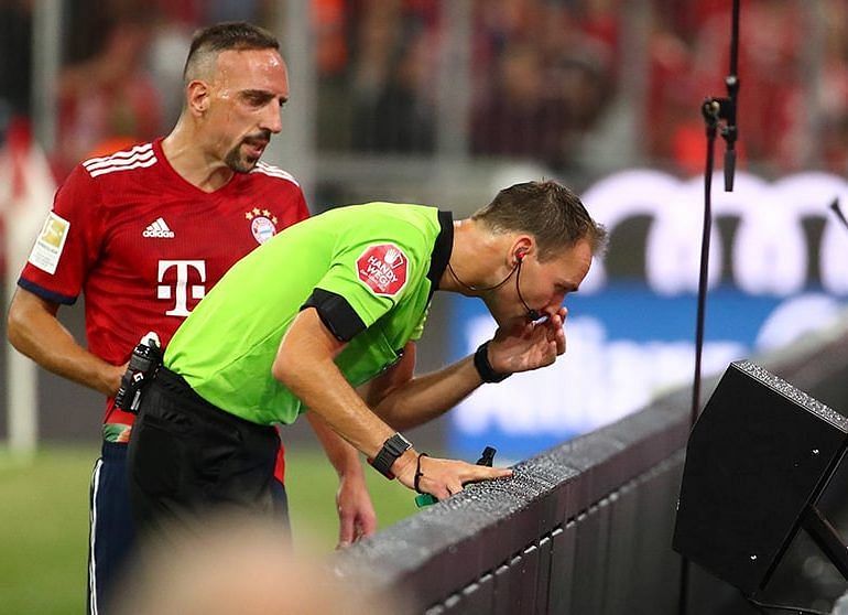 VAR being consulted during a Bundesliga game.