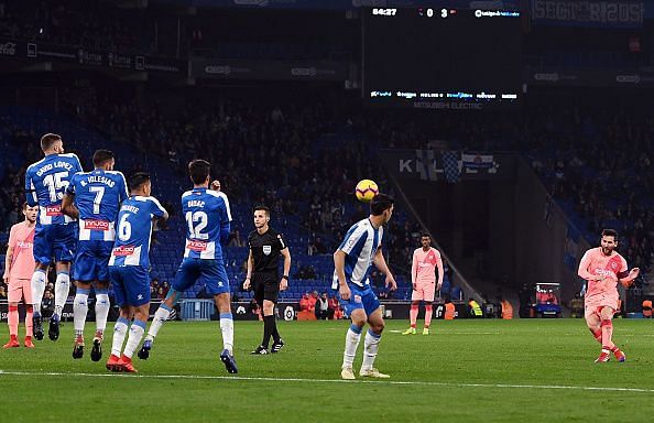Barcelona forward Lionel Messi scoring one of his two goals vs. Espanyol on Sunday