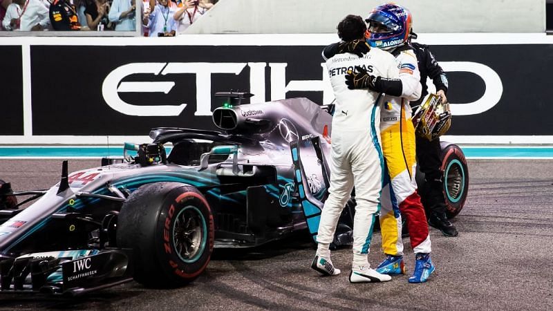 Alonso and Hamilton embrace after the Abu Dhabi Grand Prix