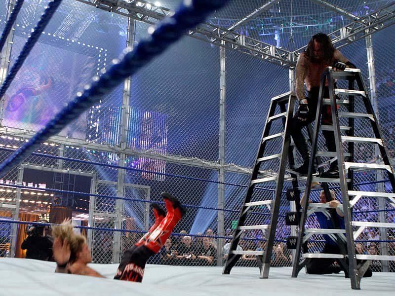 The Undertaker chokeslams the rated- superstar through Matt from the Ladder