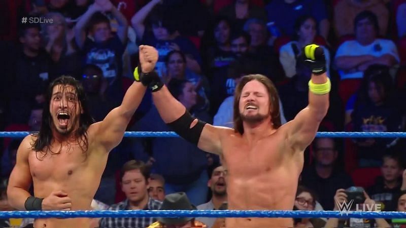 Mustafa Ali with AJ Styles after the victory