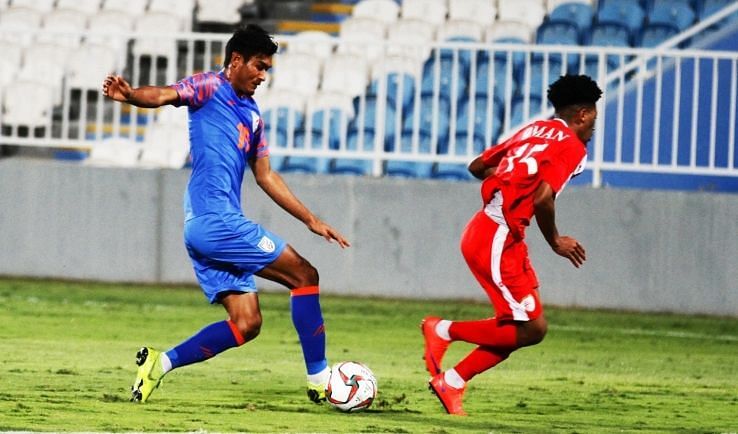 Halicharan Narzary (left) of India in action against Oman