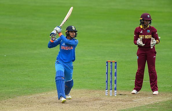 Smriti Mandhana smashing the ball towards off side and watching it going all the way to the boundary