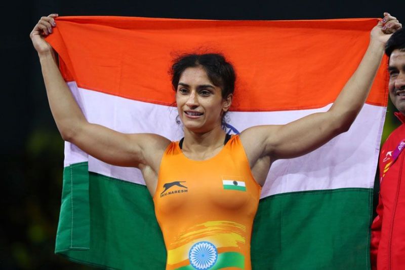 Vinesh Phogat holding tricolour after winning gold in Commonwealth Games