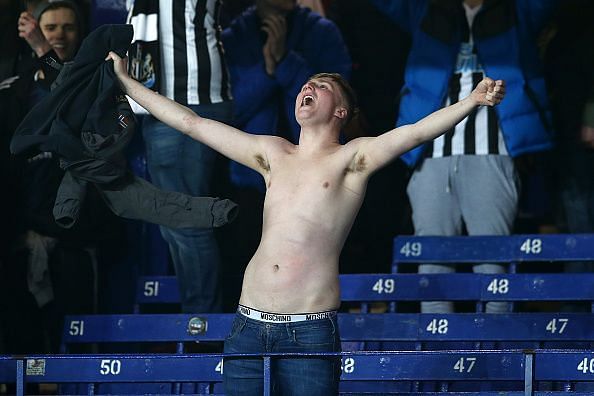A Newcastle United fan enjoys the moment at Everton on Wednesday