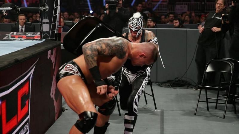Rey striking Orton with a chair