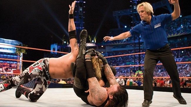 Undertaker traps Edge in his Hell&#039;s Gate submission hold.