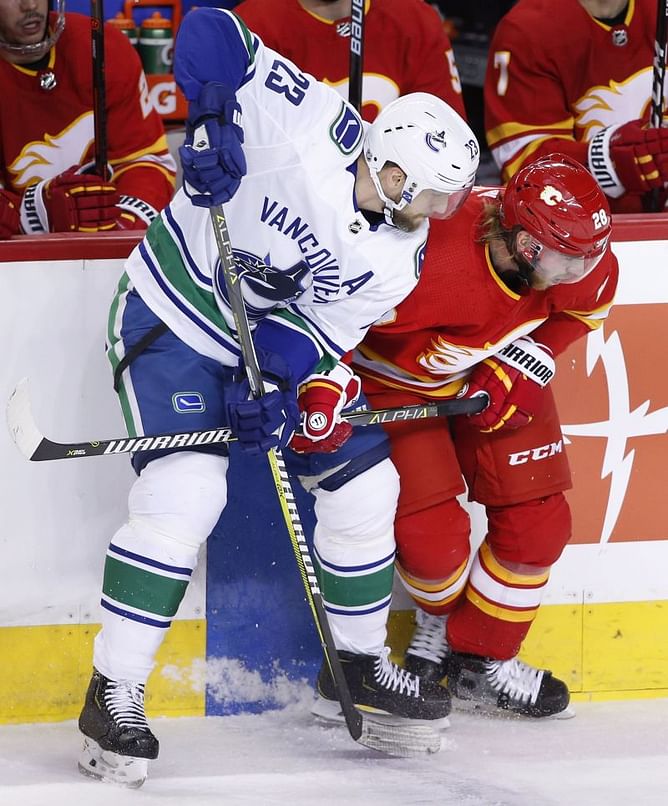 Edler scores in OT, Canucks defeat Flames 3-2