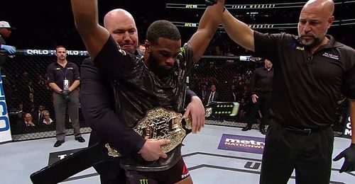 Dana White putting the Welterweight Title around Woodley's waist