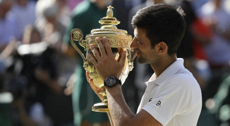 Novak Djokovic with the 2018 Wimbledon trophy