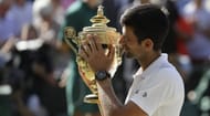 Novak Djokovic with the 2018 Wimbledon trophy