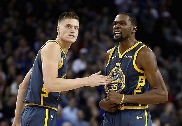 Golden State Warriors star Kevin Durant and Jonas Jerebko in action.