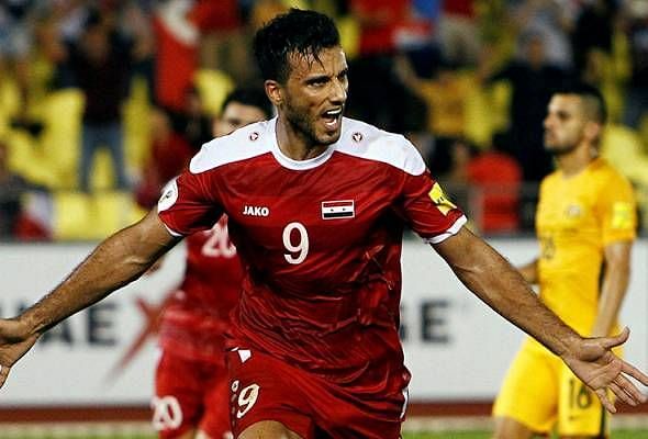 Omar Al Somah celebrating a goal