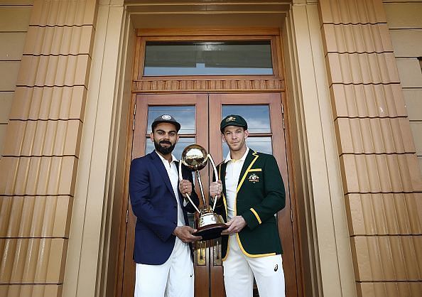 Virat Kohli (L) and Tim Paine