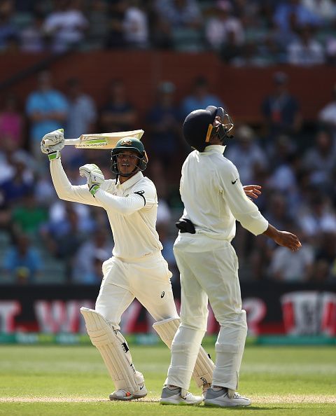 Usman Khawaja hits the ball in the air