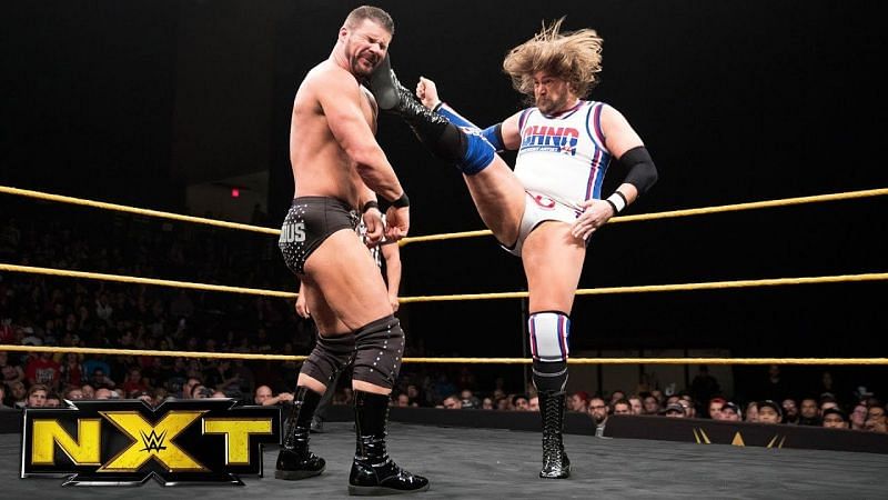 Glorious Bobby Roode eats a big boot from Kassius Ohno.