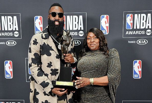 James Harden holding the MVP trophy with his mom