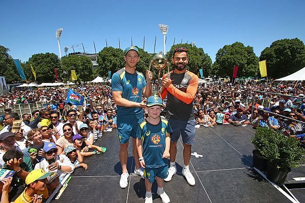Tim Paine and Virat Kohli along with Archie Schiller from Make-A-Wish Foundation