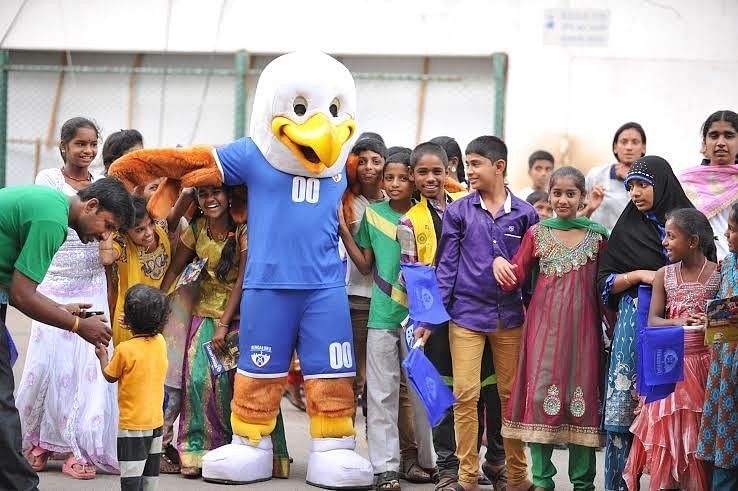 Eddie, the BFC mascot, interacts with children