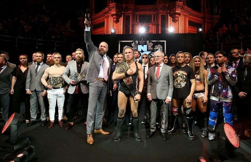 The NXT UK roster, with Triple H and GM Johnny Saint.