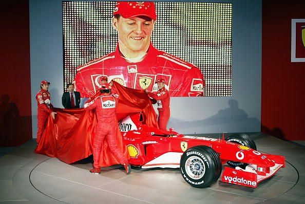 Ferrari F1 drivers Michael Schumacher of Germany and Rubens Barrichello of Brazil and test drivers Felipe Massa and Luca Badoer unveil Ferrari&#039;s new F1 car