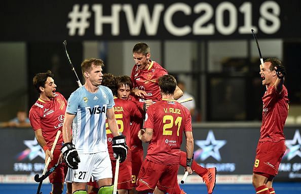 Spanish players celebrate after scoring a goal against Argentina