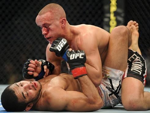 Mark Hominick braves a hideous head injury to mount Jose Aldo