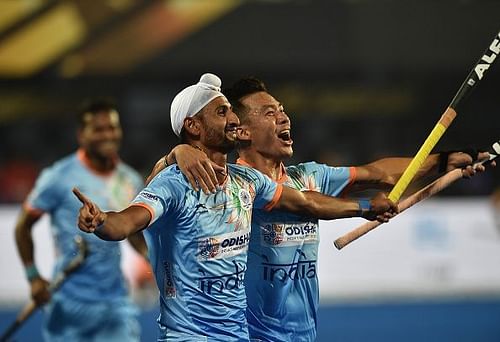 Indian players celebrate after scoring a goal against South Africa