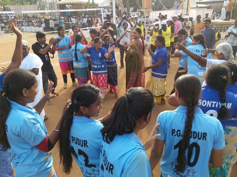 The two finalist Throwball teams dancing with the chief guest Karnam Malleshwari after the final match
