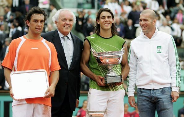 Rafael Nadal poses with his first French Open trophy along with the legendary Zinedine Zidane, 2005