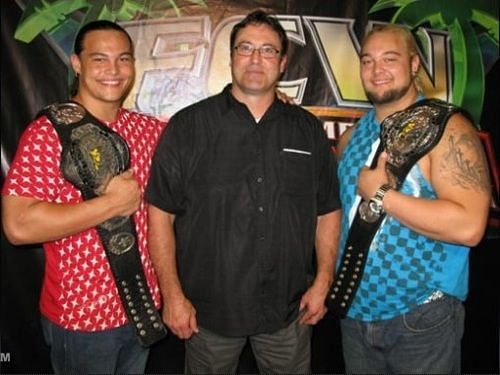 Bo Dallas (L) and Bray Wyatt (R) with their father Mike Rotunda (C)
